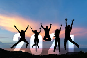 Silhouette happy business teamwork jumping congratulation and celebrate in Happy New year 2021 for change new life future concept. Freedom lifestyle group people team jump as part of Number 2021 success at the sunset beach outdoor