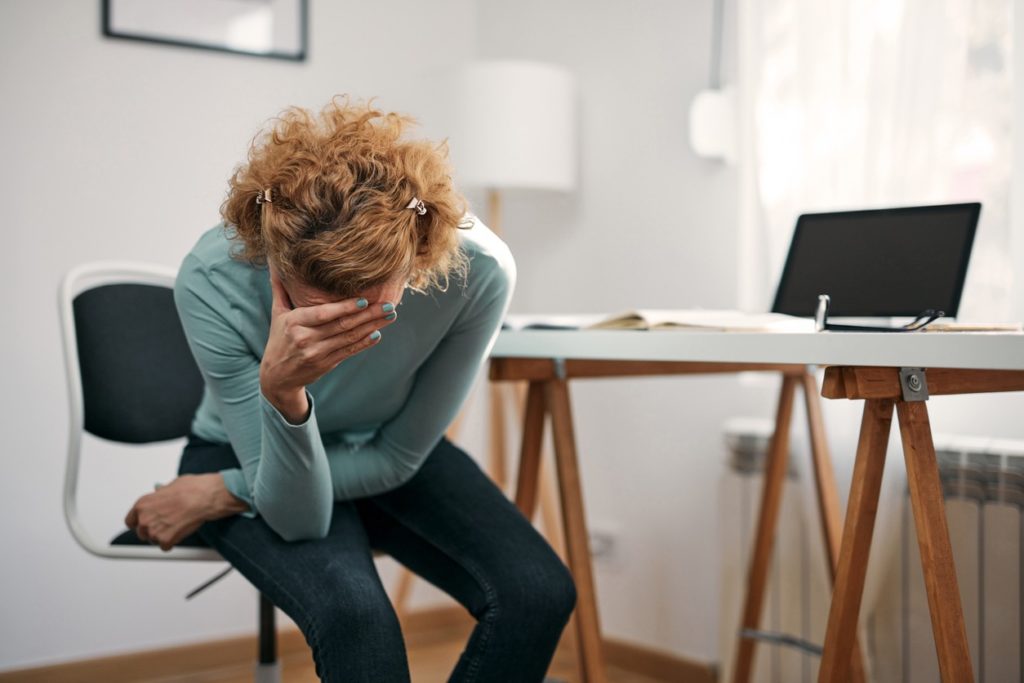 woman-bending-over-with-vertigo-bend-total-body-chiropractic