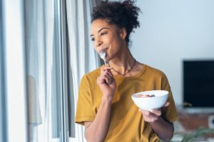 african-american-woman-eating-cereal