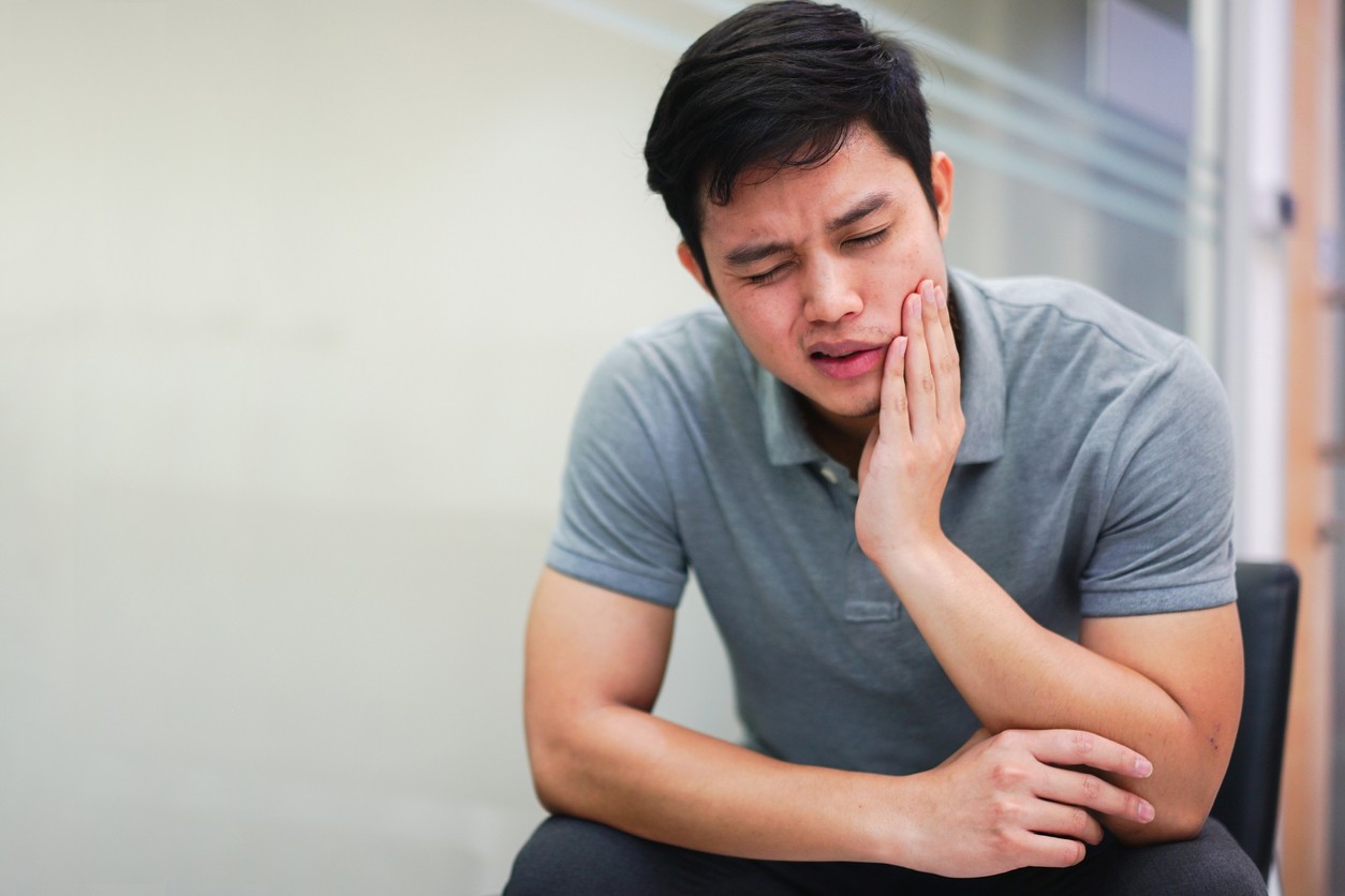 asian-man-with-jaw-pain-from-tmj