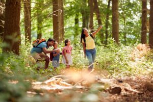 A family goes hiking in a forest in Bend. Oregon.