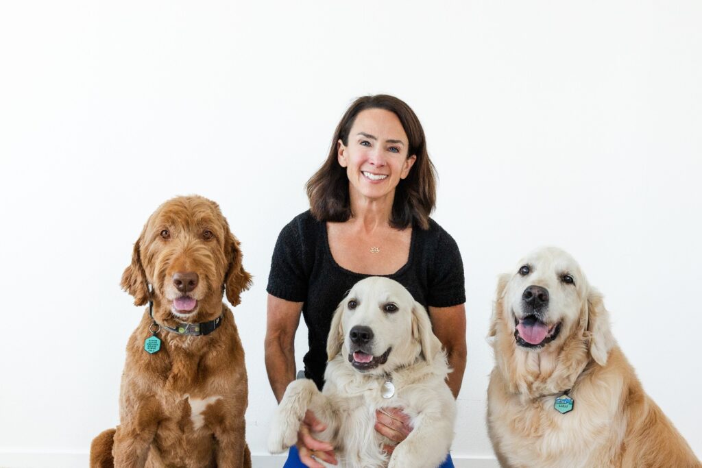 Chiropractor bari and her dogs posing for the camera.