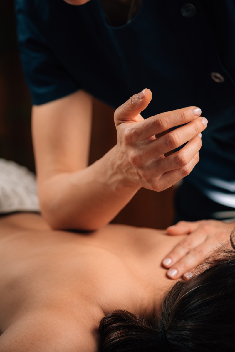 A massage therapist in Bend, Oregon performs deep tissue massage on a patient.
